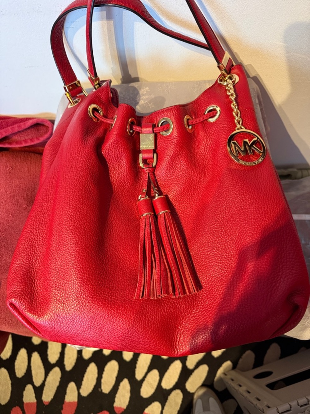 Michael Kors Red Pebbled Leather Drawstring Hobo with Tassel and MK Charm